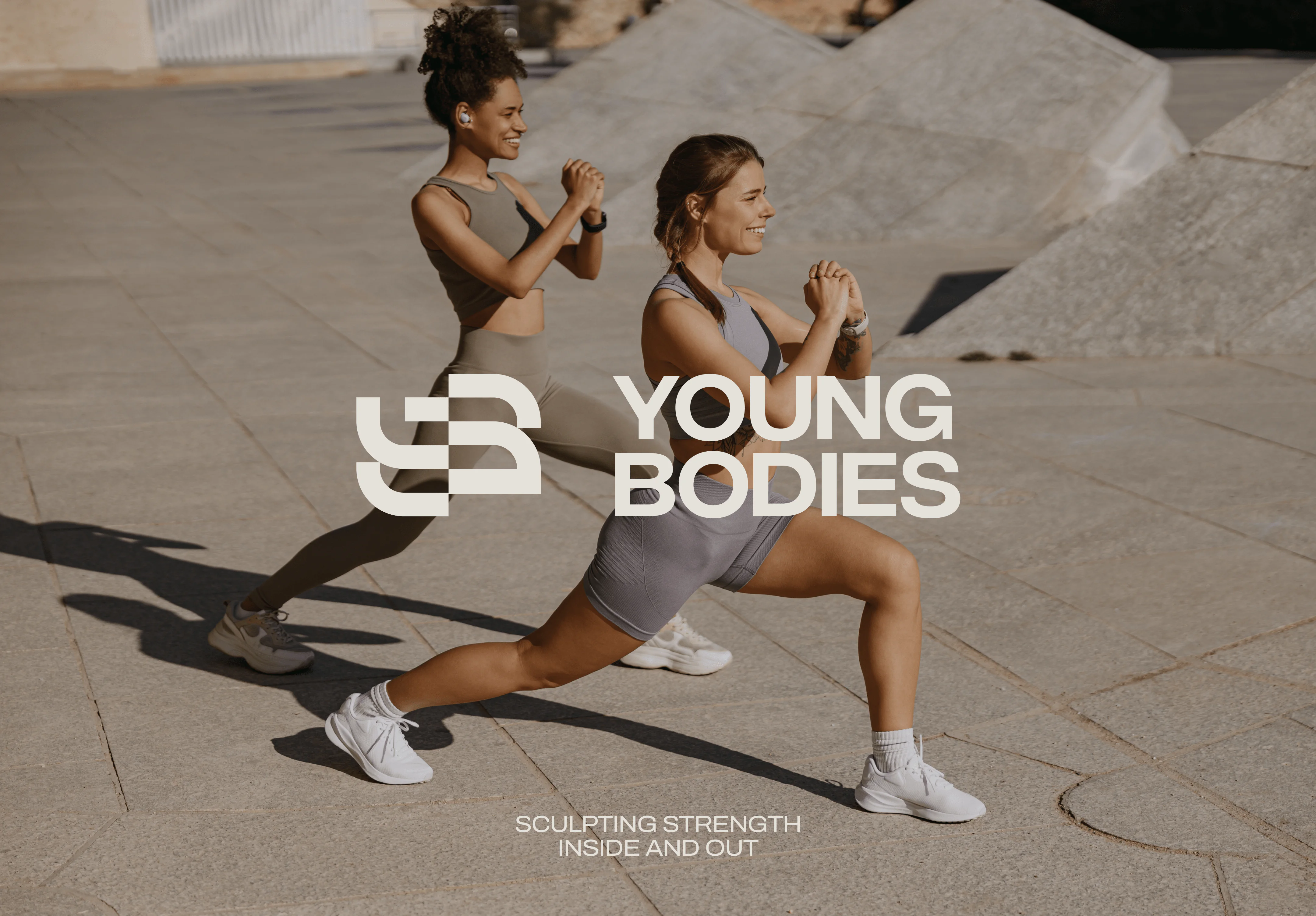 Two women doing lunges outdoors
