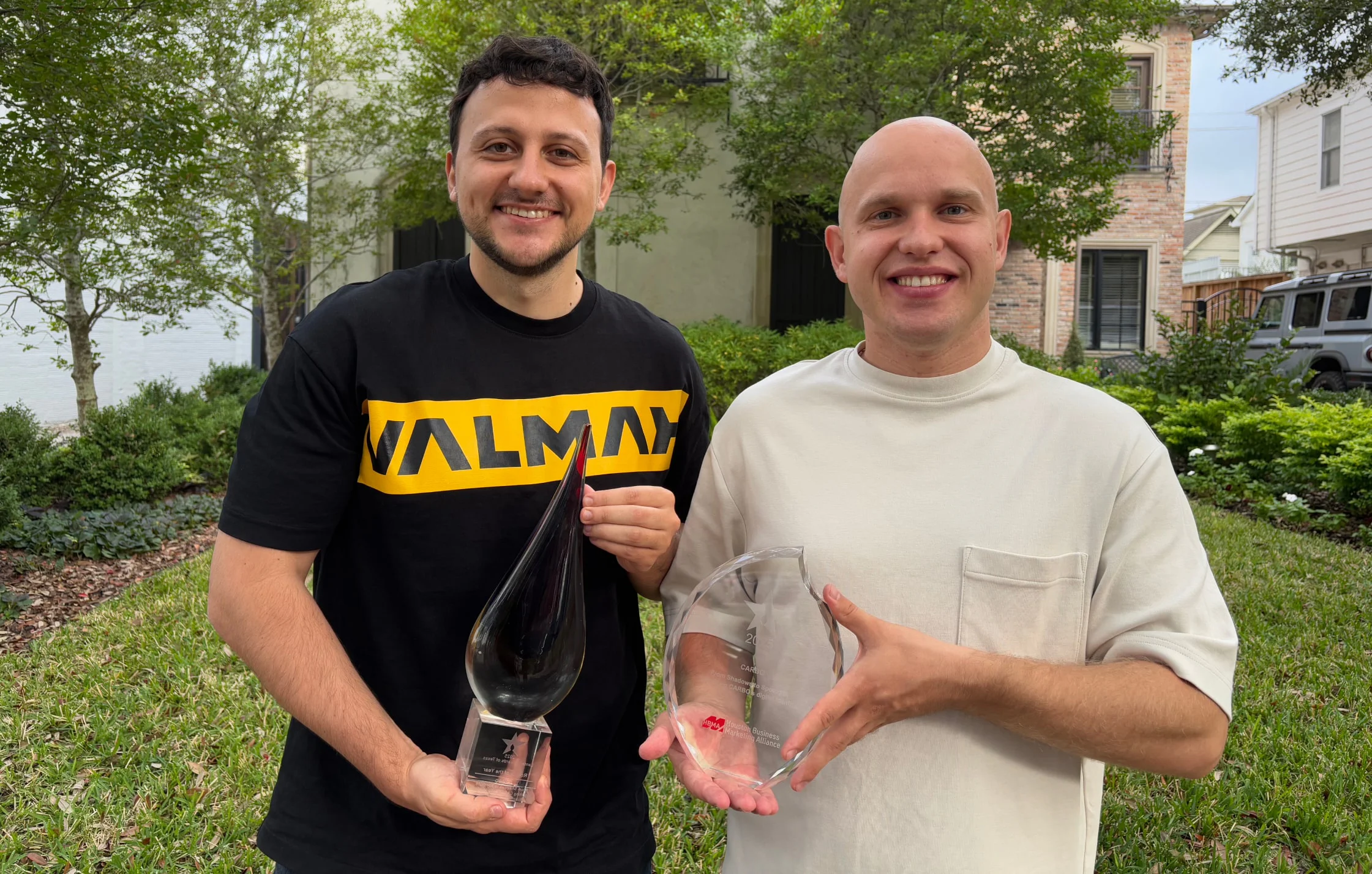 Award winners photo Two men holding awards