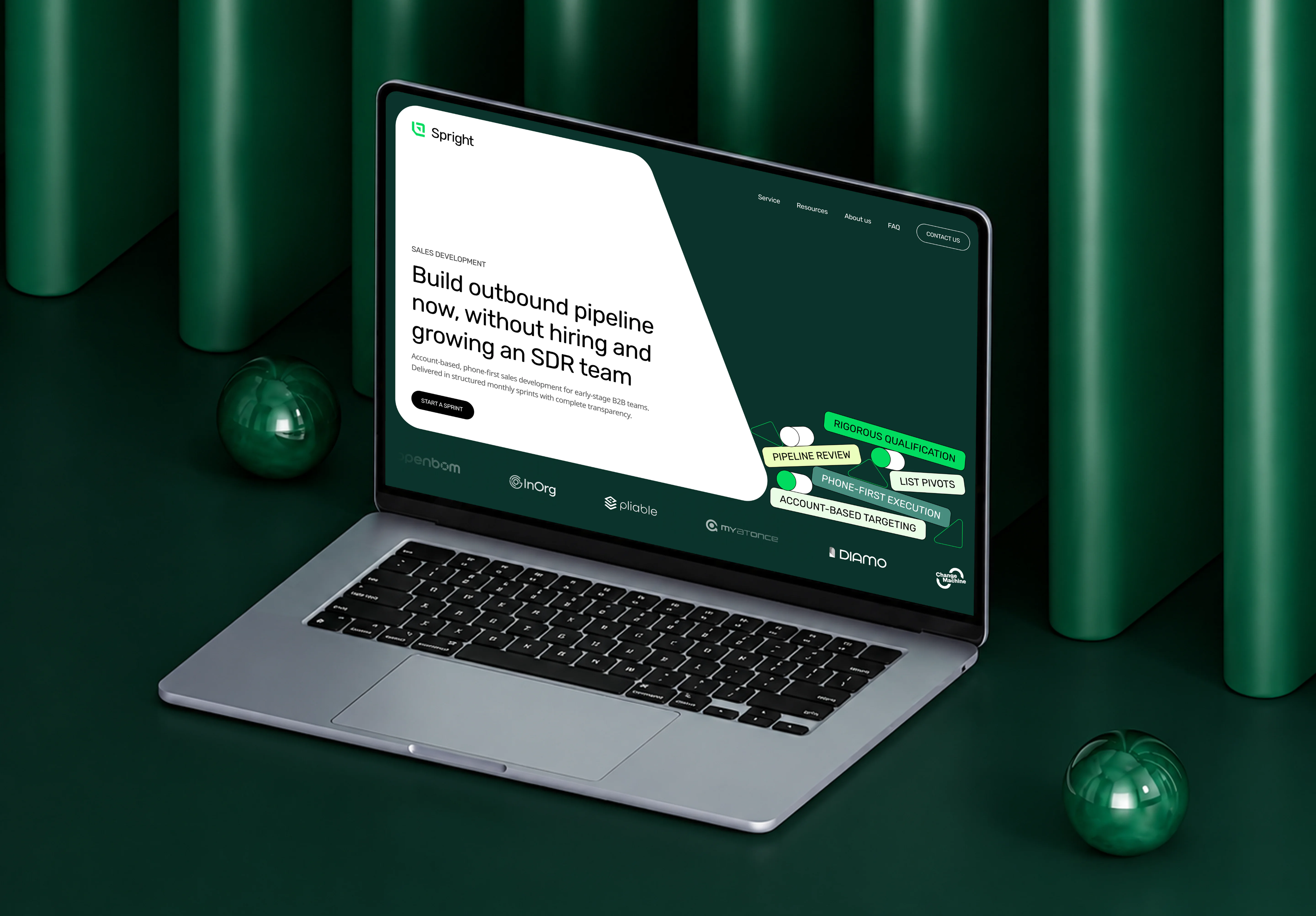Spright website displayed on a laptop in a green branded scene