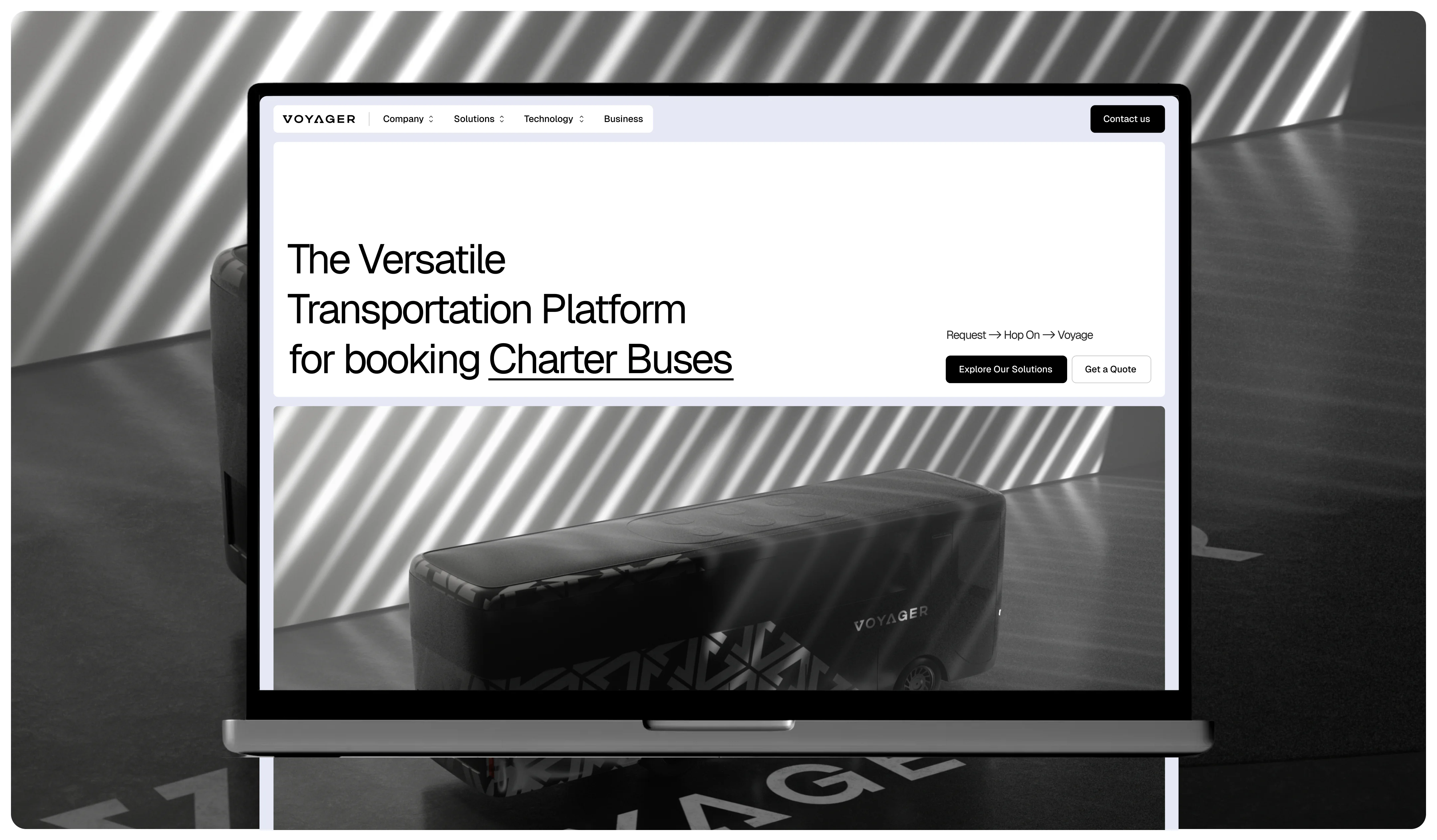 transportation platform website displayed on a laptop mockup with a charter bus booking hero section
