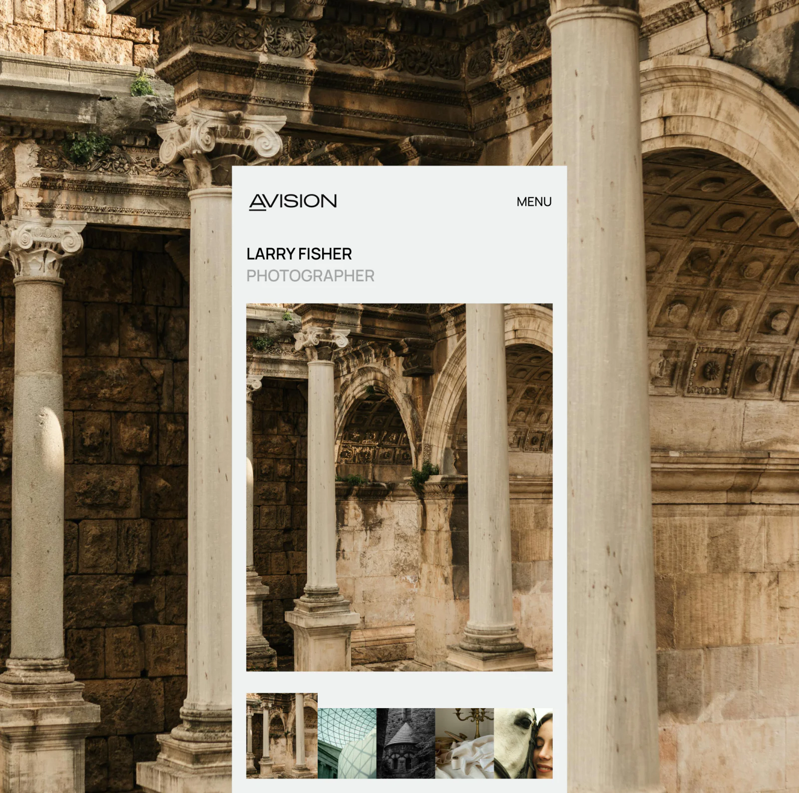 Photographer portfolio website displayed against classical architecture