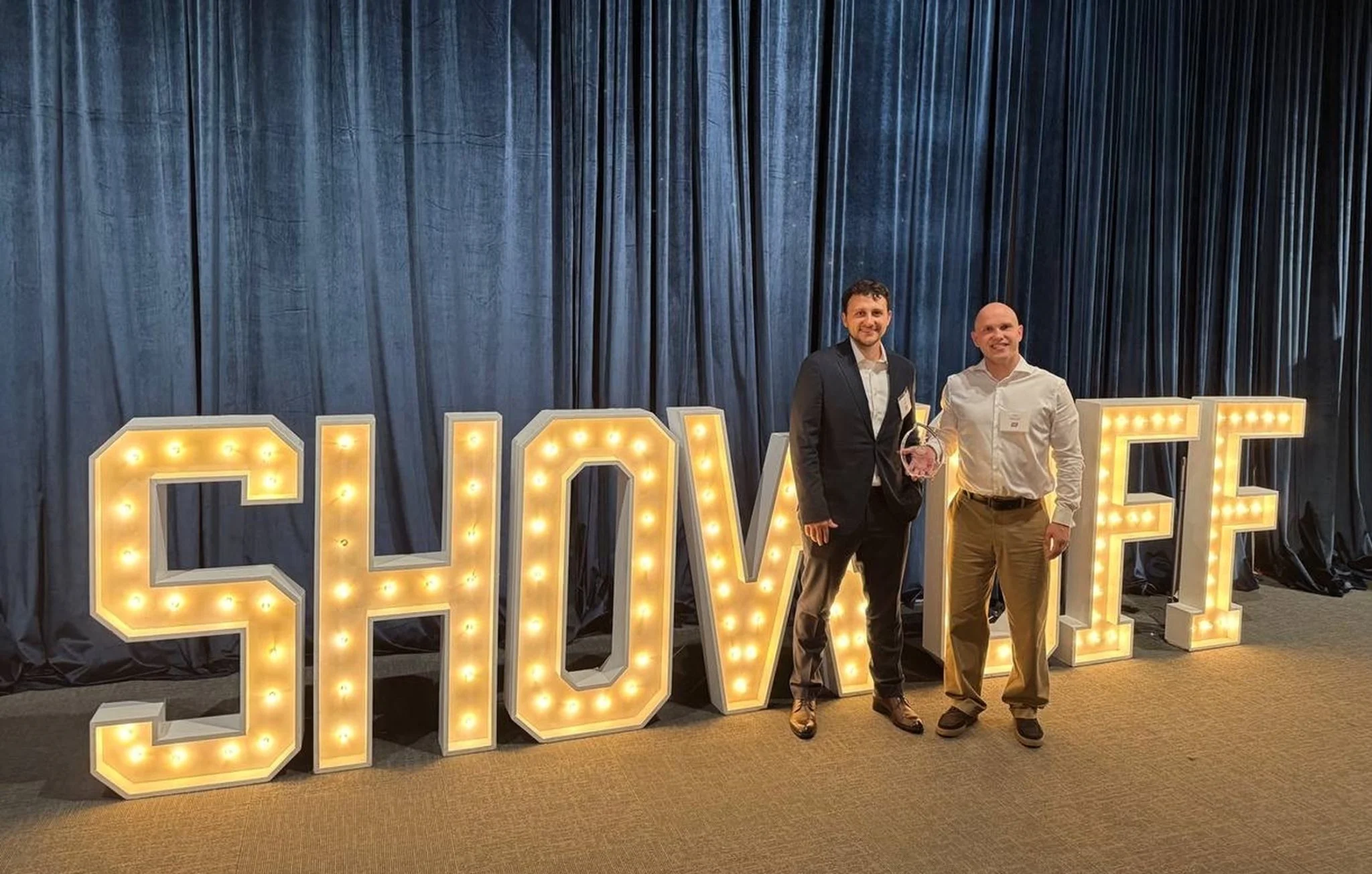 Award ceremony photo Two men at award event