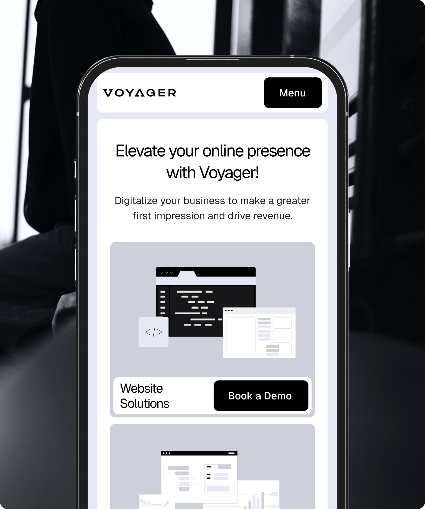 responsive website displayed on a smartphone with service cards and a Book a Demo button