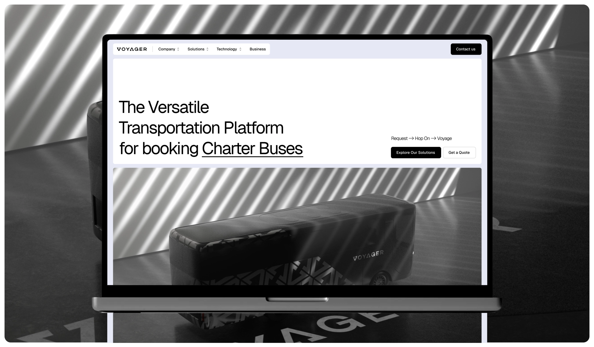 transportation platform website displayed on a laptop mockup with a charter bus booking hero section