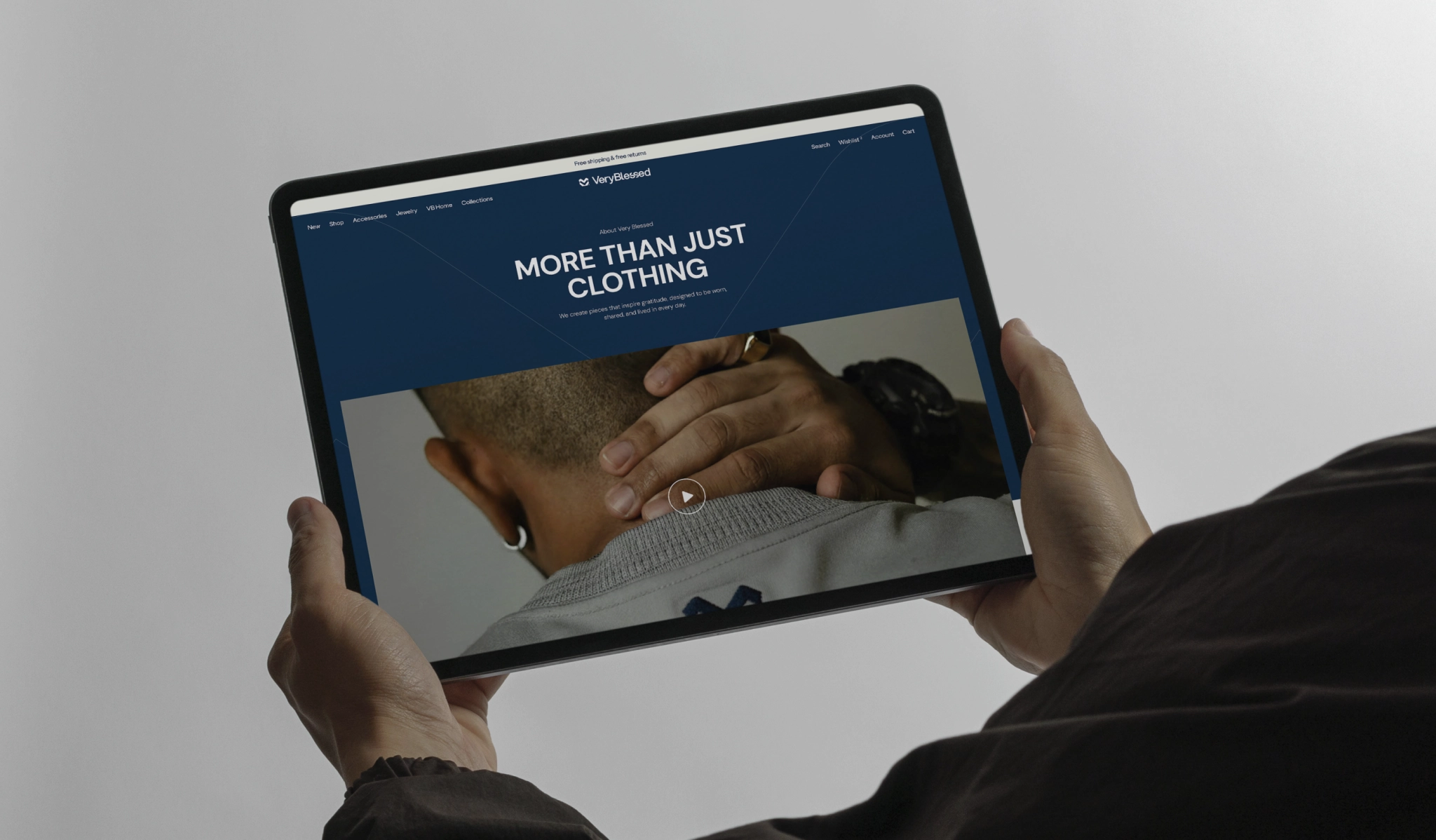 fashion website About Us page displayed on a tablet with a brand story video